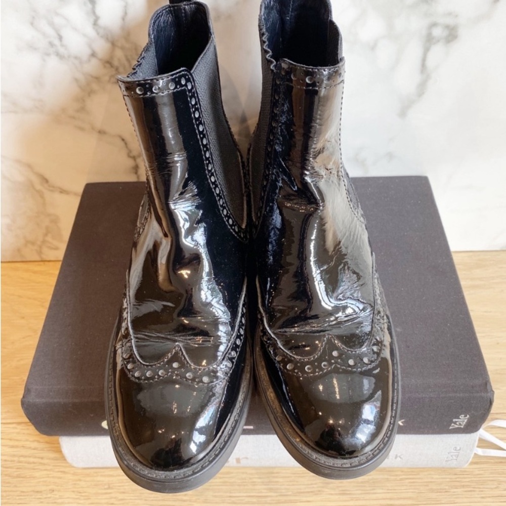 Aquatalia Black patent wing-tip Chelsea boots.